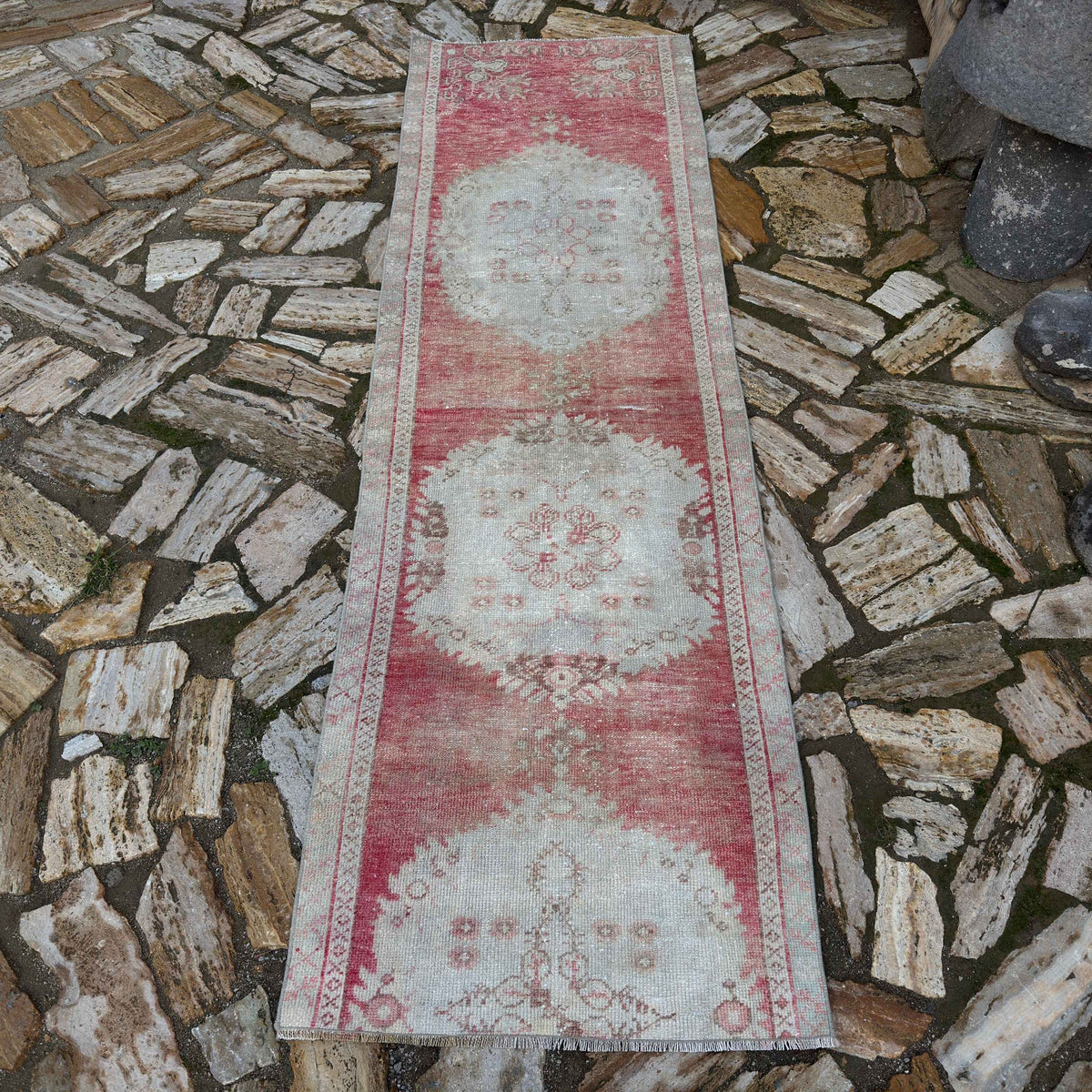 Pale Red 3' x 8' Turkish distressed runner rug in wool and cotton, shown on the floor.
