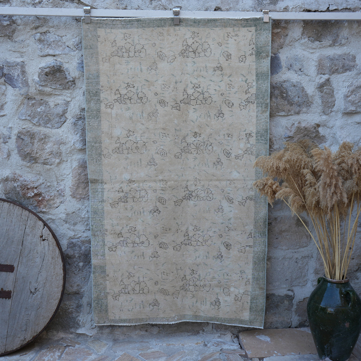 Beige 4' x 6' distressed vintage rug with floral design, handmade in Turkey – Estel.
