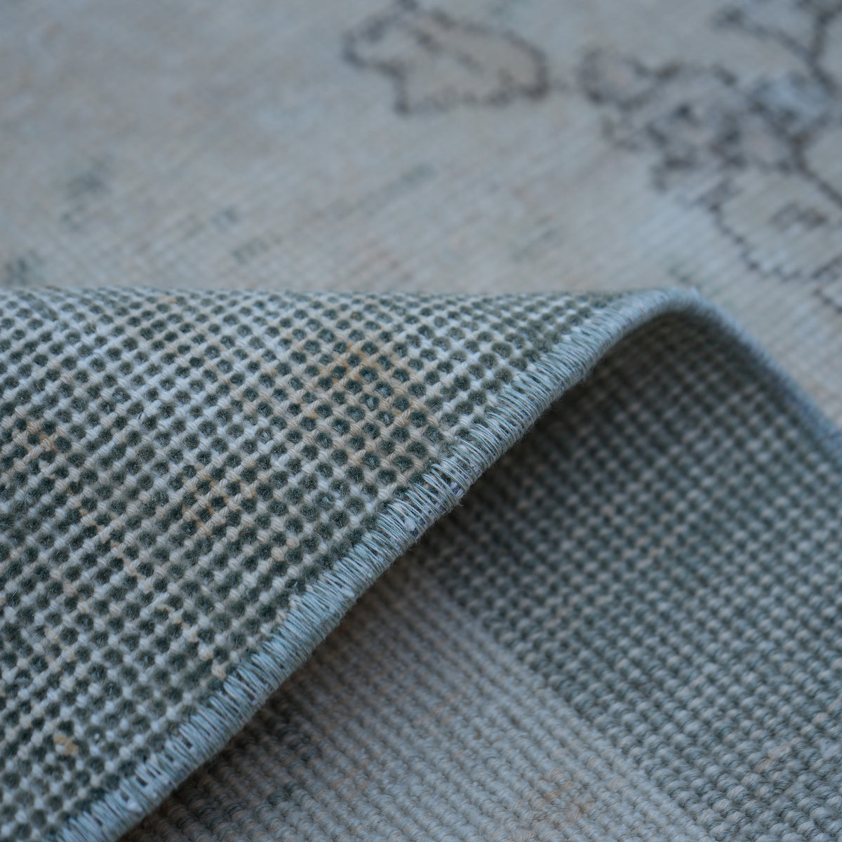 Additional view of the beige Turkish distressed vintage rug, hand-knotted in wool and cotton.