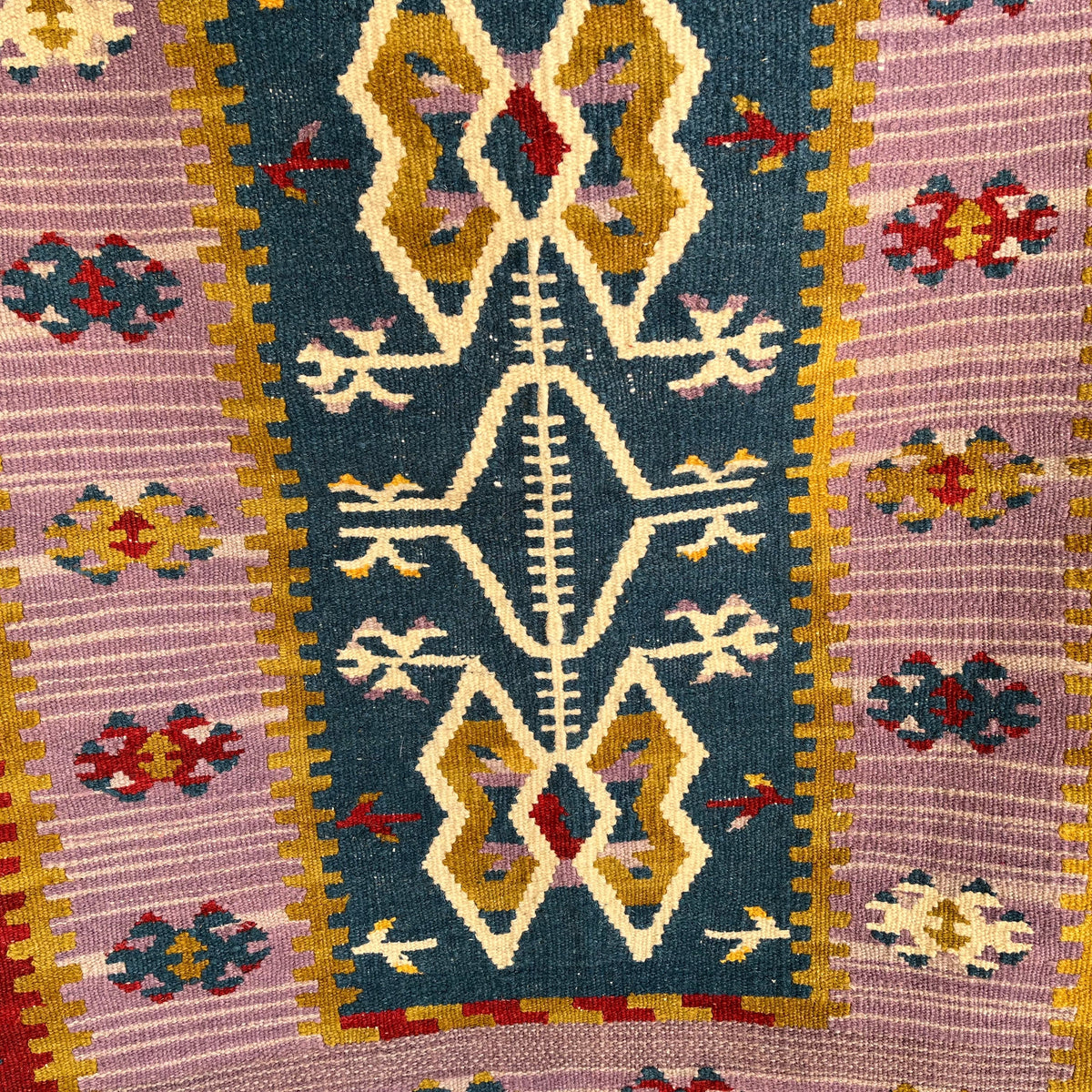 Close-up of the blue Turkish flatweave rug showing traditional details, flatweave construction, wool and cotton and low pile.