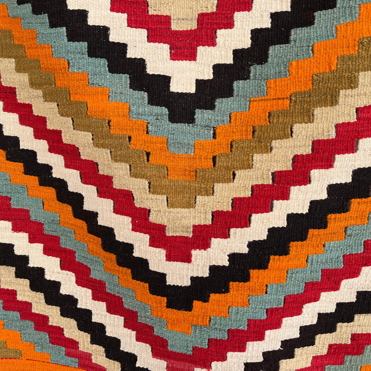 Close-up of the orange Turkish flatwoven rugs showing traditional details, flatweave construction, wool and cotton and low pile.