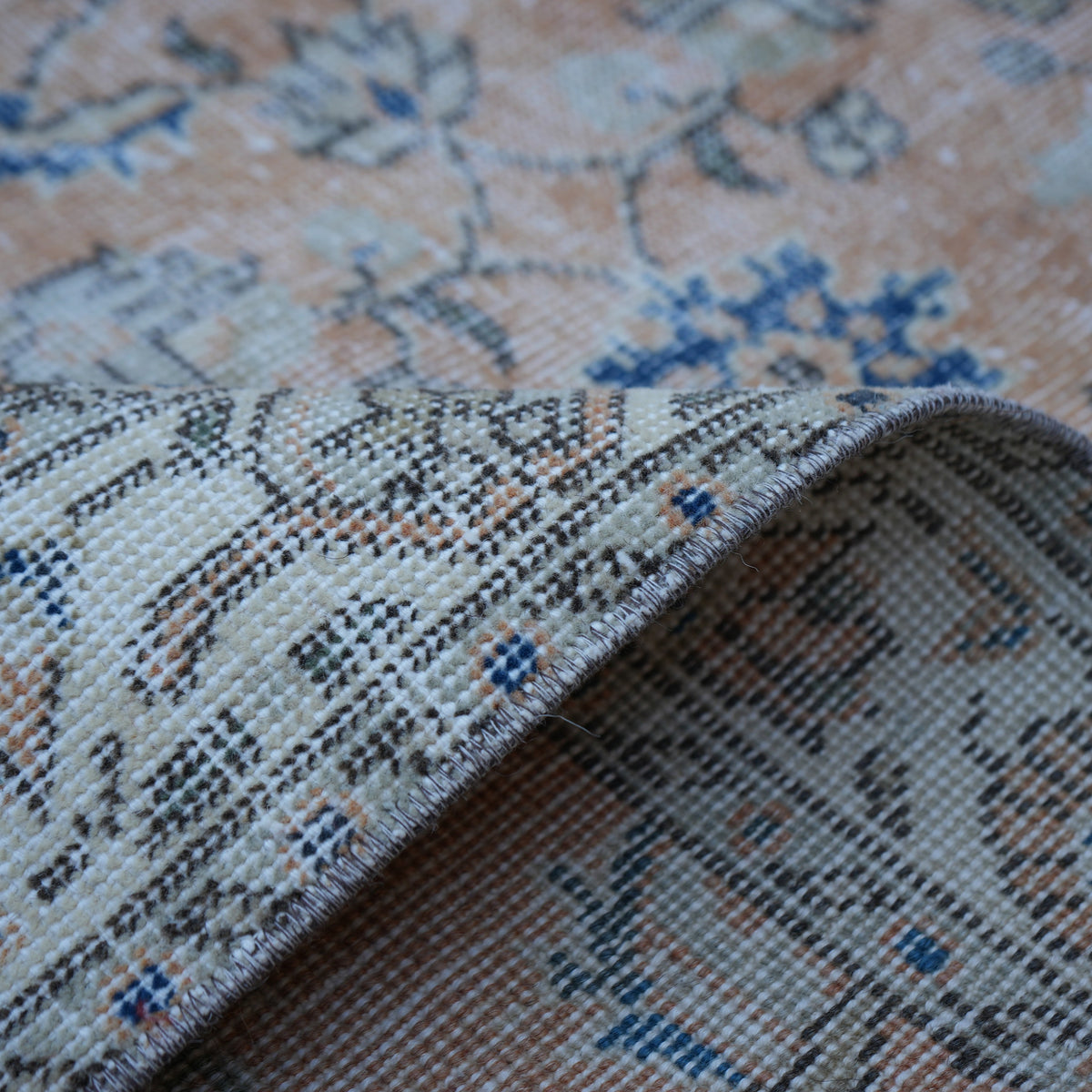 Additional view of the orange Turkish floral vintage rug, hand-knotted in wool and cotton.