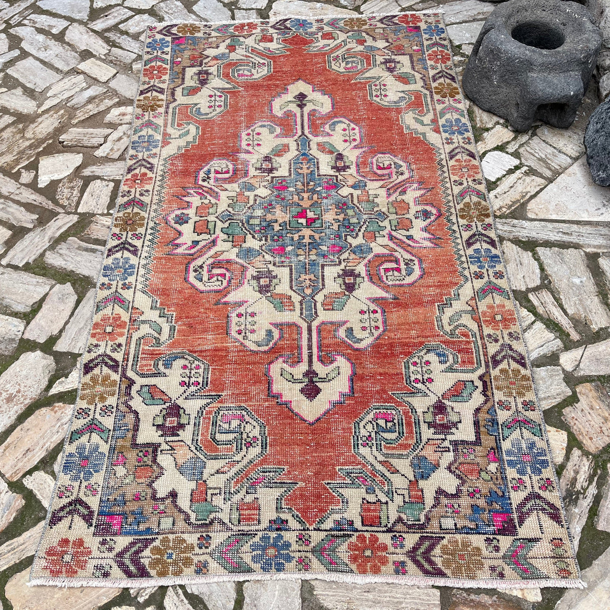 Red 4' x 7' Turkish handknoted rug in wool and cotton, shown on the floor.