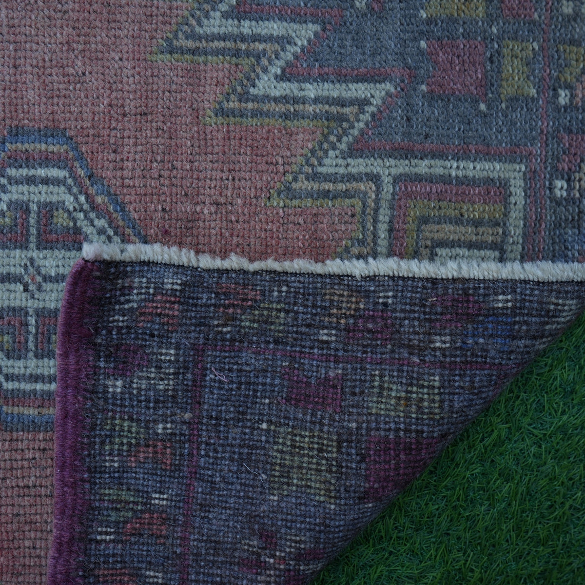 1970s light red Turkish handknotted rug with traditional design, hand-knotted weave and low pile.