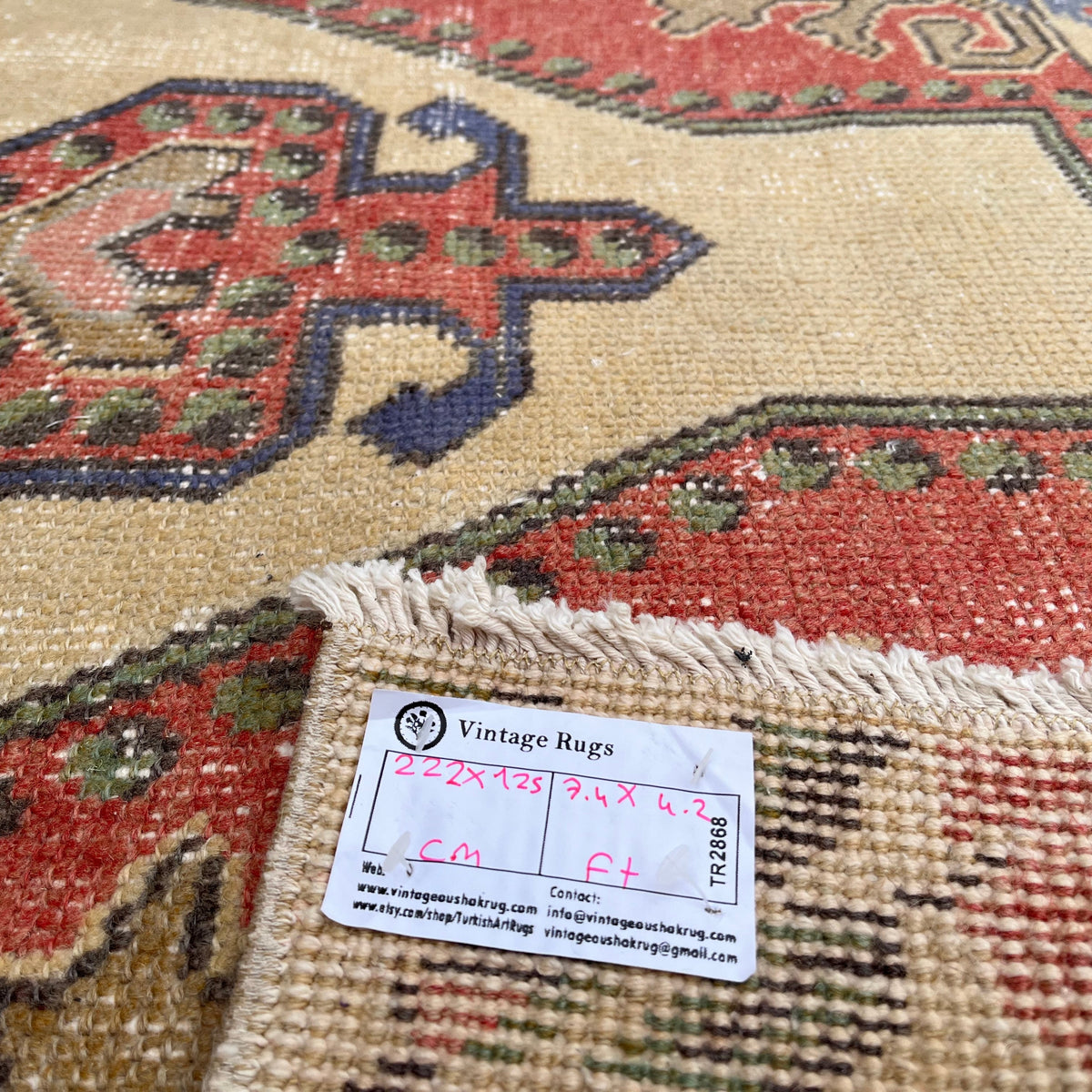 Close-up of the blue Turkish handknotted rug showing traditional details, hand-knotted weave, wool and cotton and low pile.