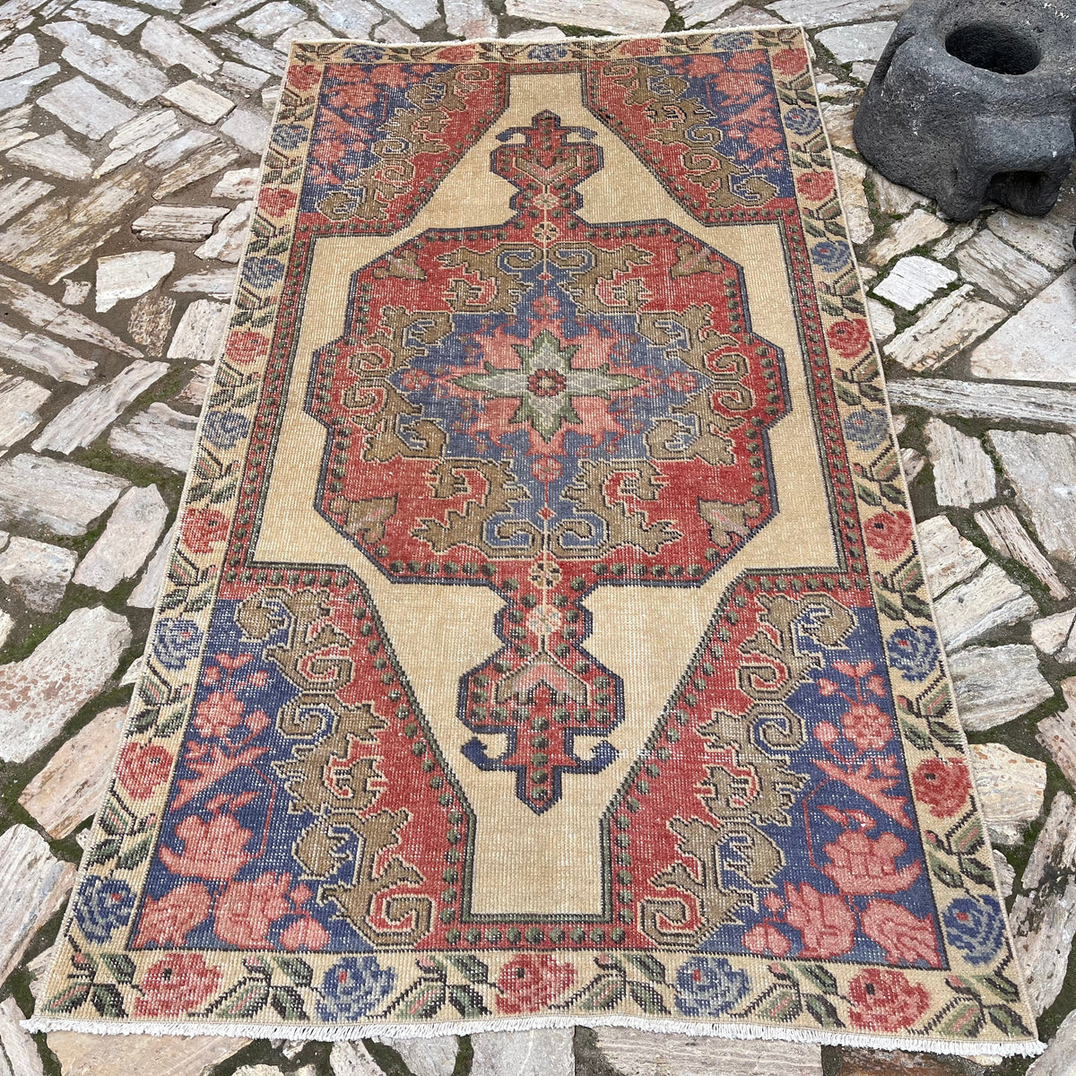 Blue 4' x 7' Turkish handknotted rug in wool and cotton, shown on the floor.