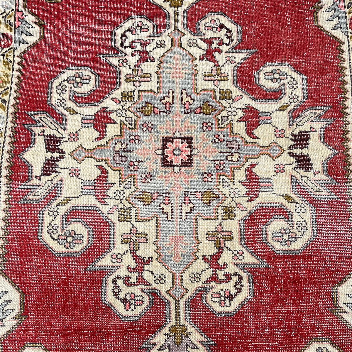 1970s red Turkish handknotted rug with traditional design, hand-knotted weave and low pile.