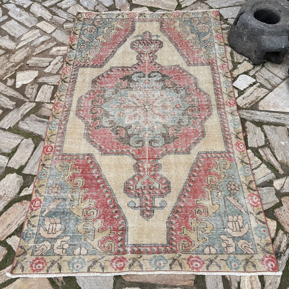 Red 4' x 7' Turkish handknotted rug in wool and cotton, shown on the floor.