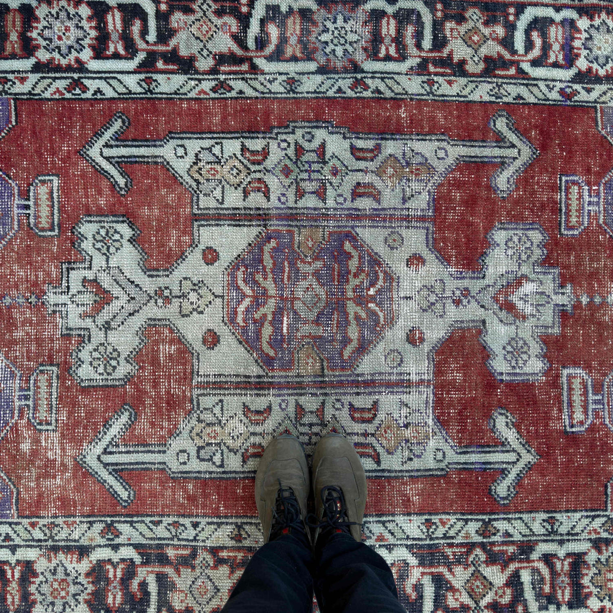 1970s purple Turkish handknotted rug with geometric design, hand-knotted weave and low pile.