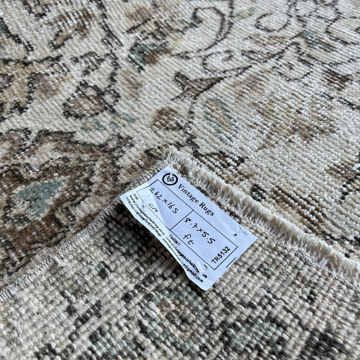 1970s green Turkish handknotted rug with neutral design, hand-knotted weave and low pile.
