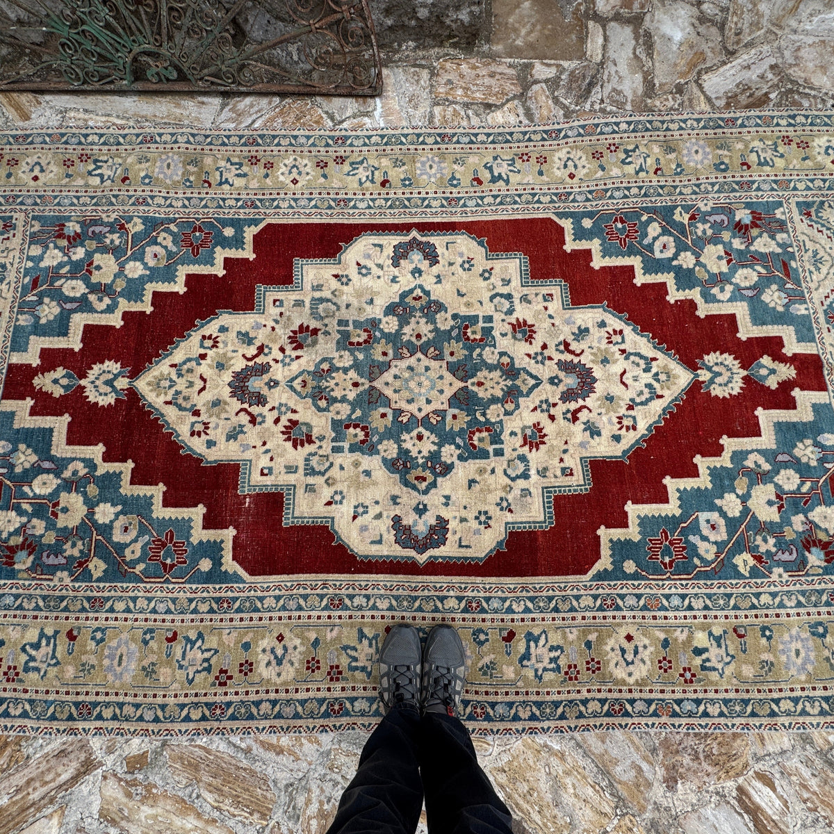 1970s red Turkish handmade traditinoal rug with traditional design, hand-knotted weave and low pile.