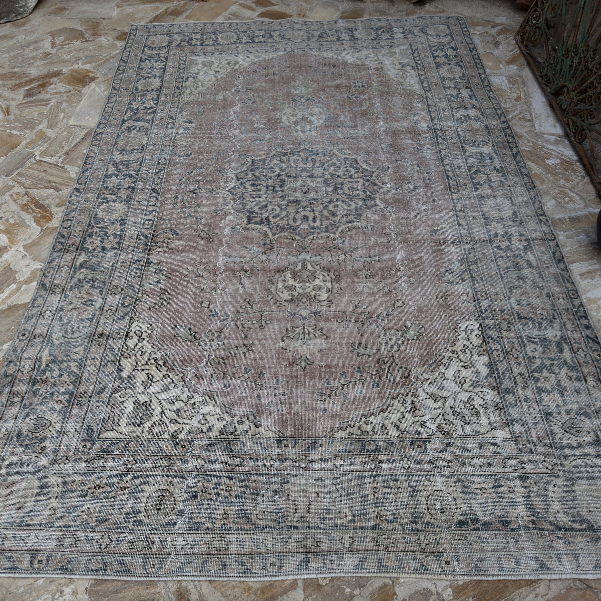 Blue 6' x 10' Turkish handmade vintage wool rug in wool and cotton, shown on the floor.