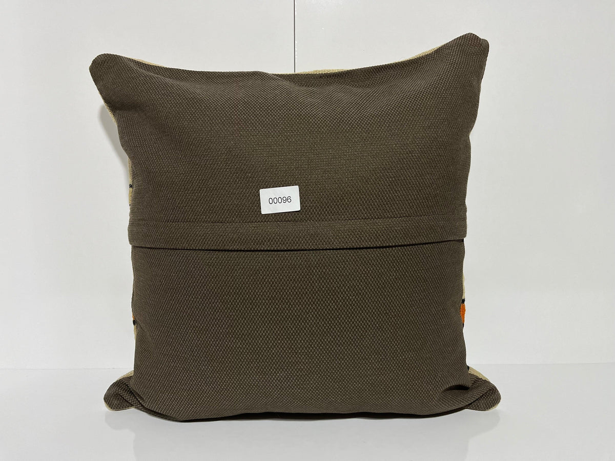 Close-up of the beige Turkish kilim pillow showing striped details.