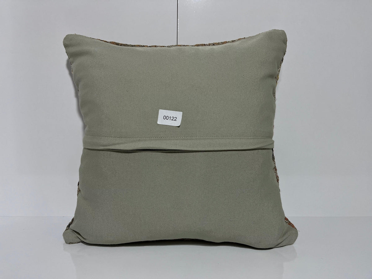 Close-up of the gray Turkish kilim pillow showing traditional details.