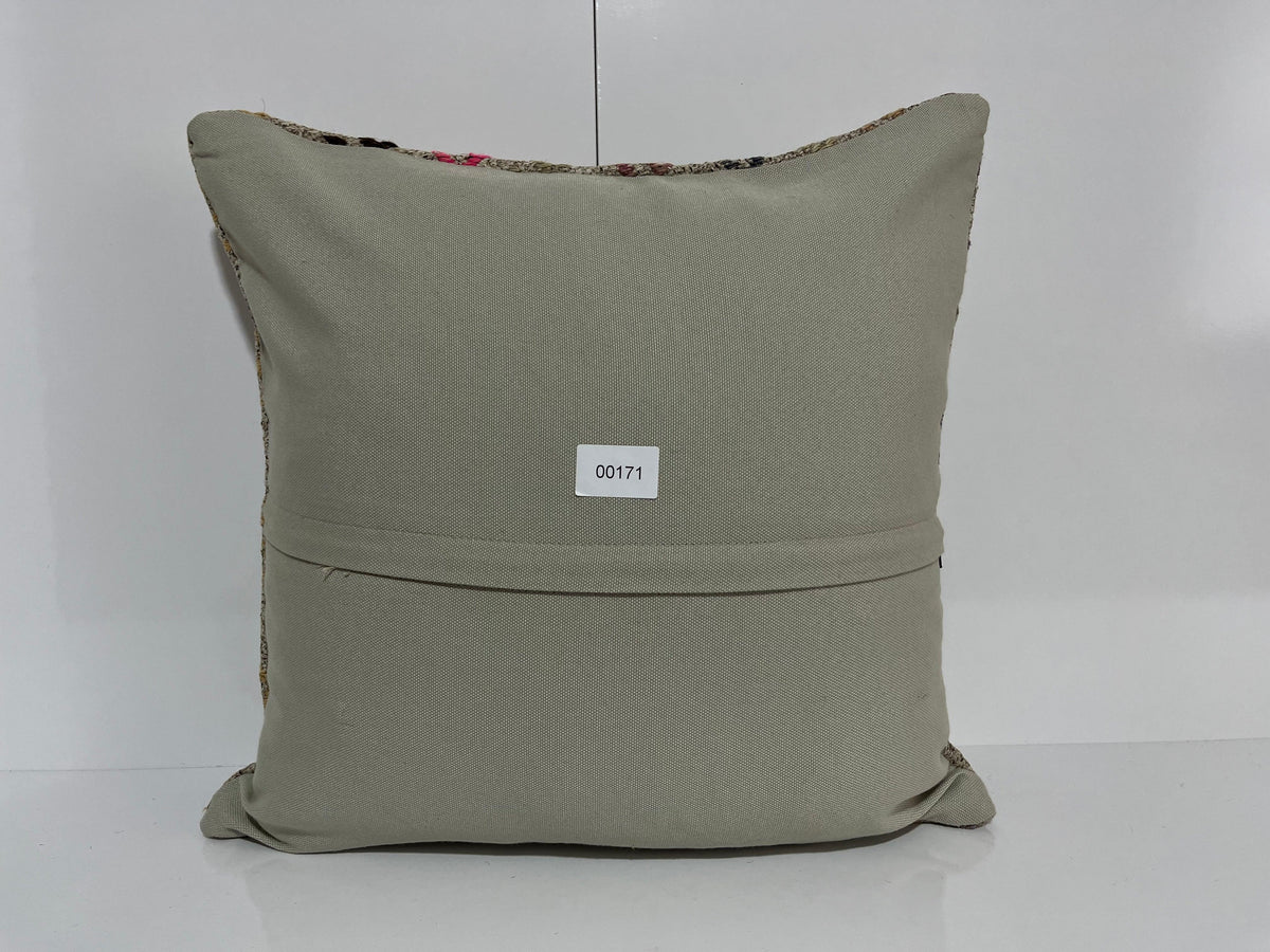 Close-up of the gray Turkish kilim pillow showing traditional details.