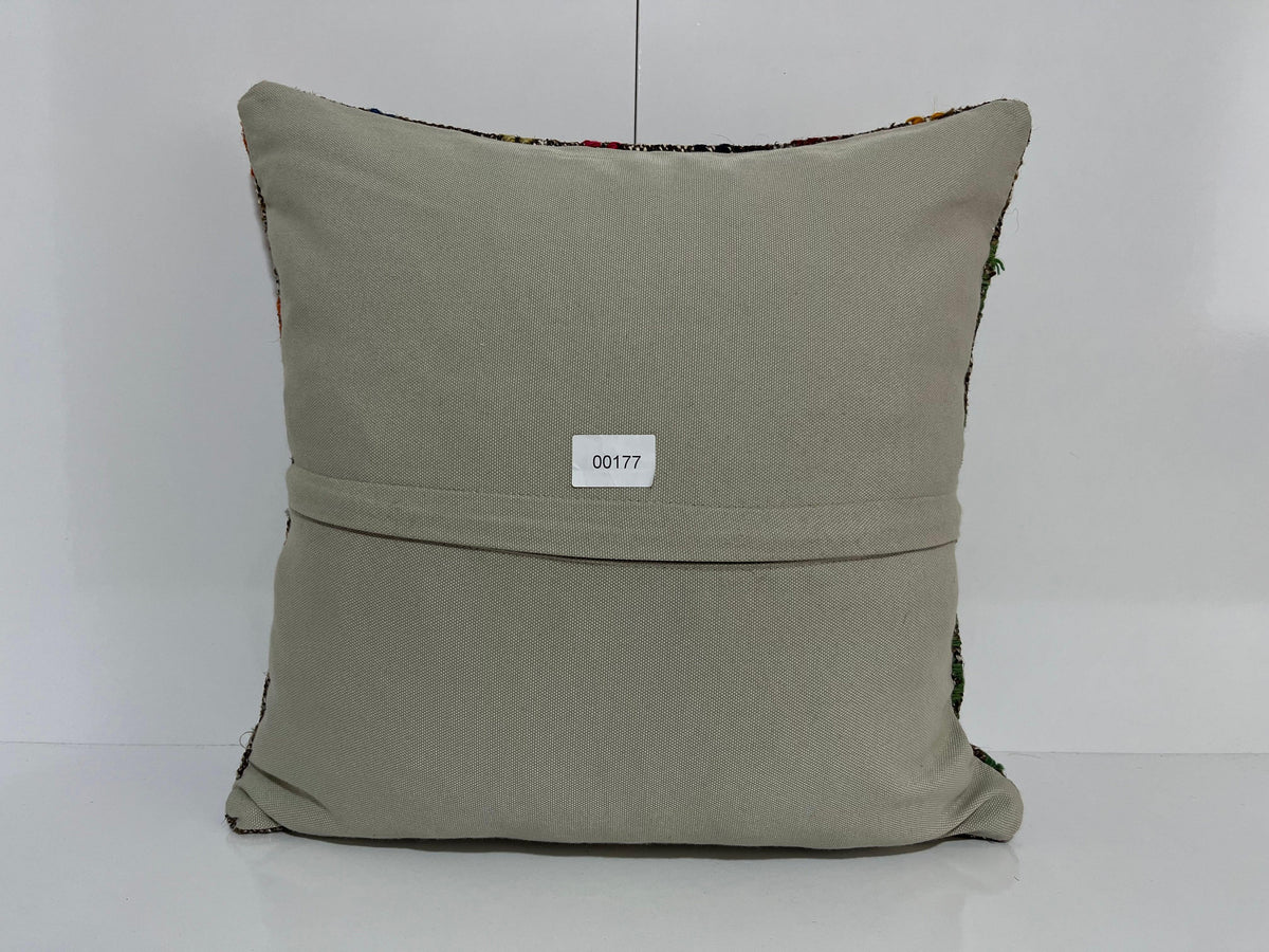Close-up of the gray Turkish kilim pillow showing traditional details.