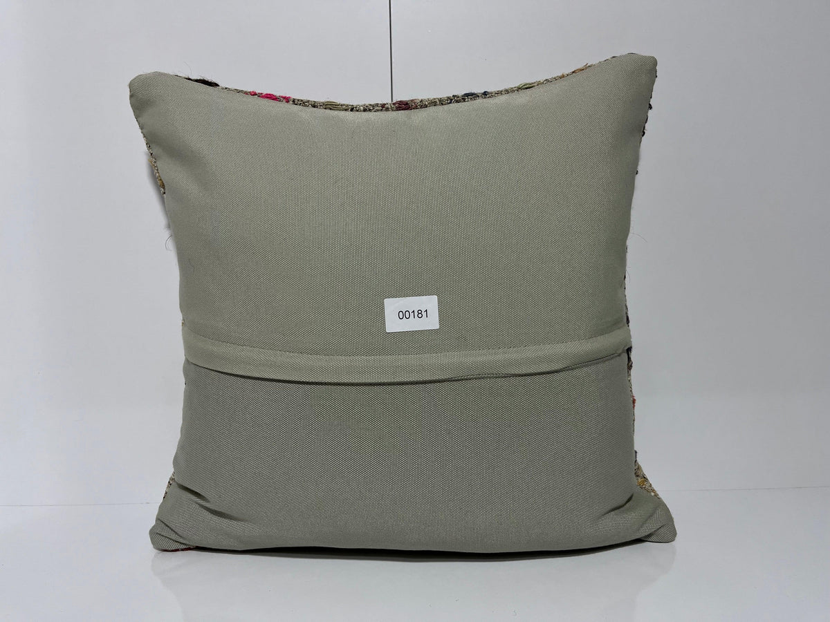 Close-up of the gray Turkish kilim pillow showing traditional details.