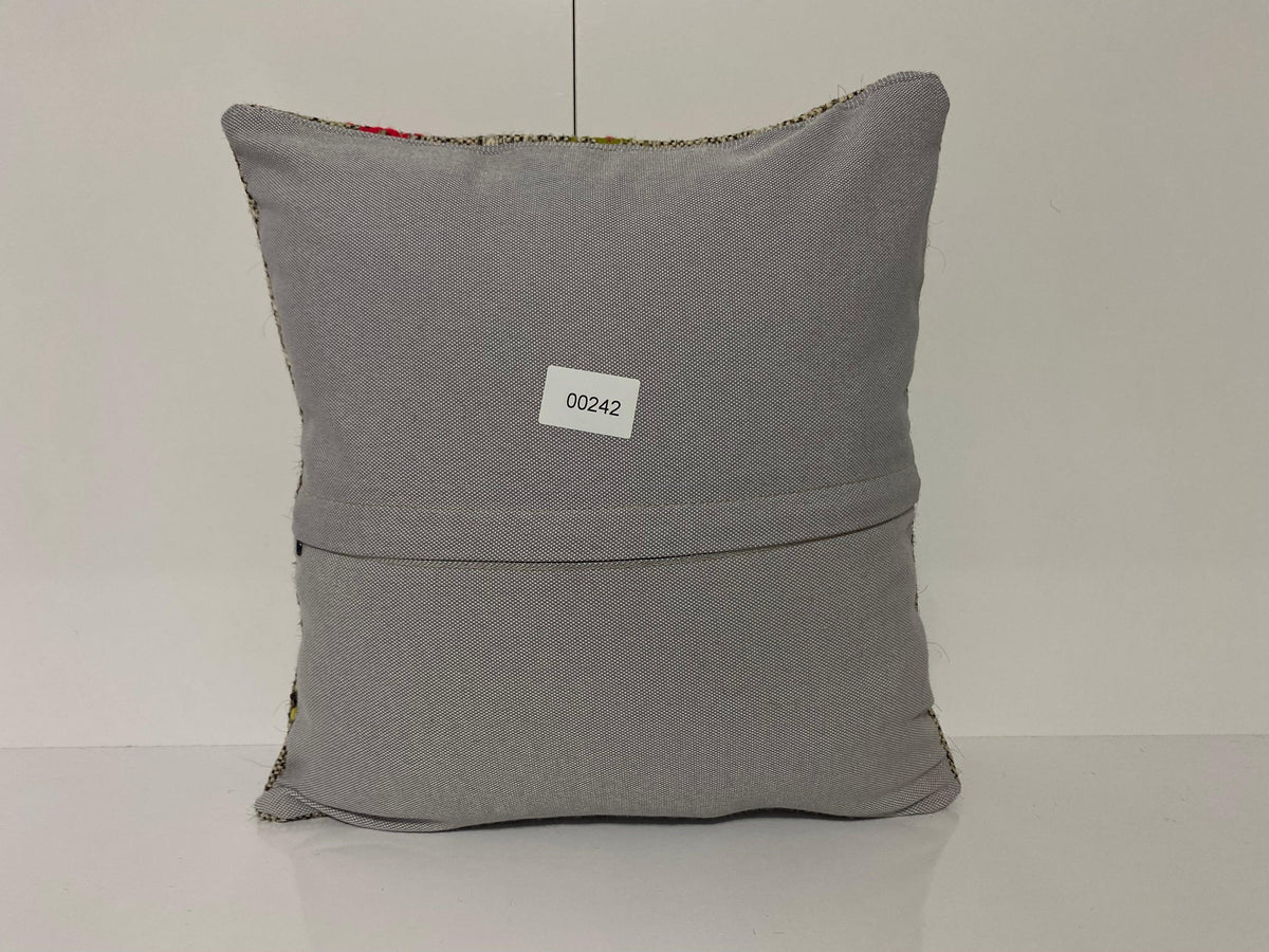 Close-up of the gray Turkish kilim pillow showing traditional details.