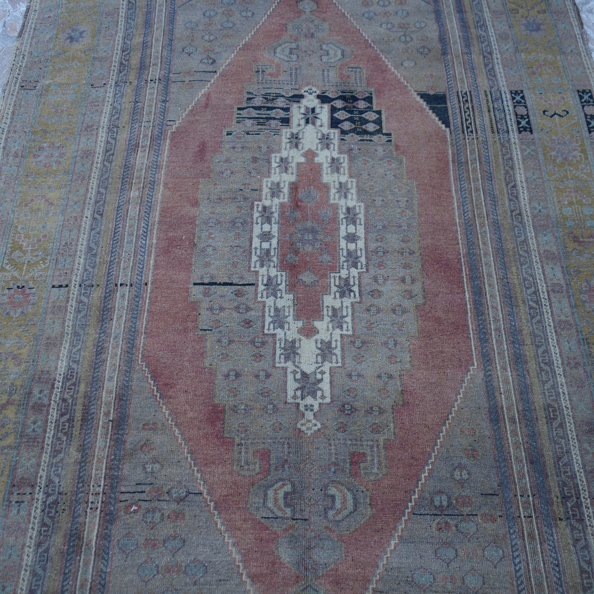 Close-up of the pale brown Turkish large wool rug showing traditional details, hand-knotted weave, wool and low pile.