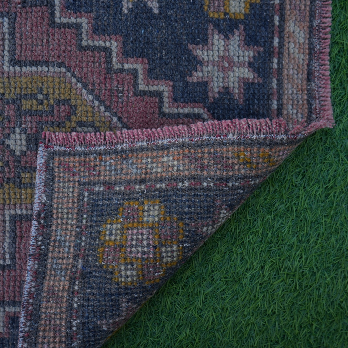 1970s red mini turkish rug with traditional design, hand-knotted weave and low pile.