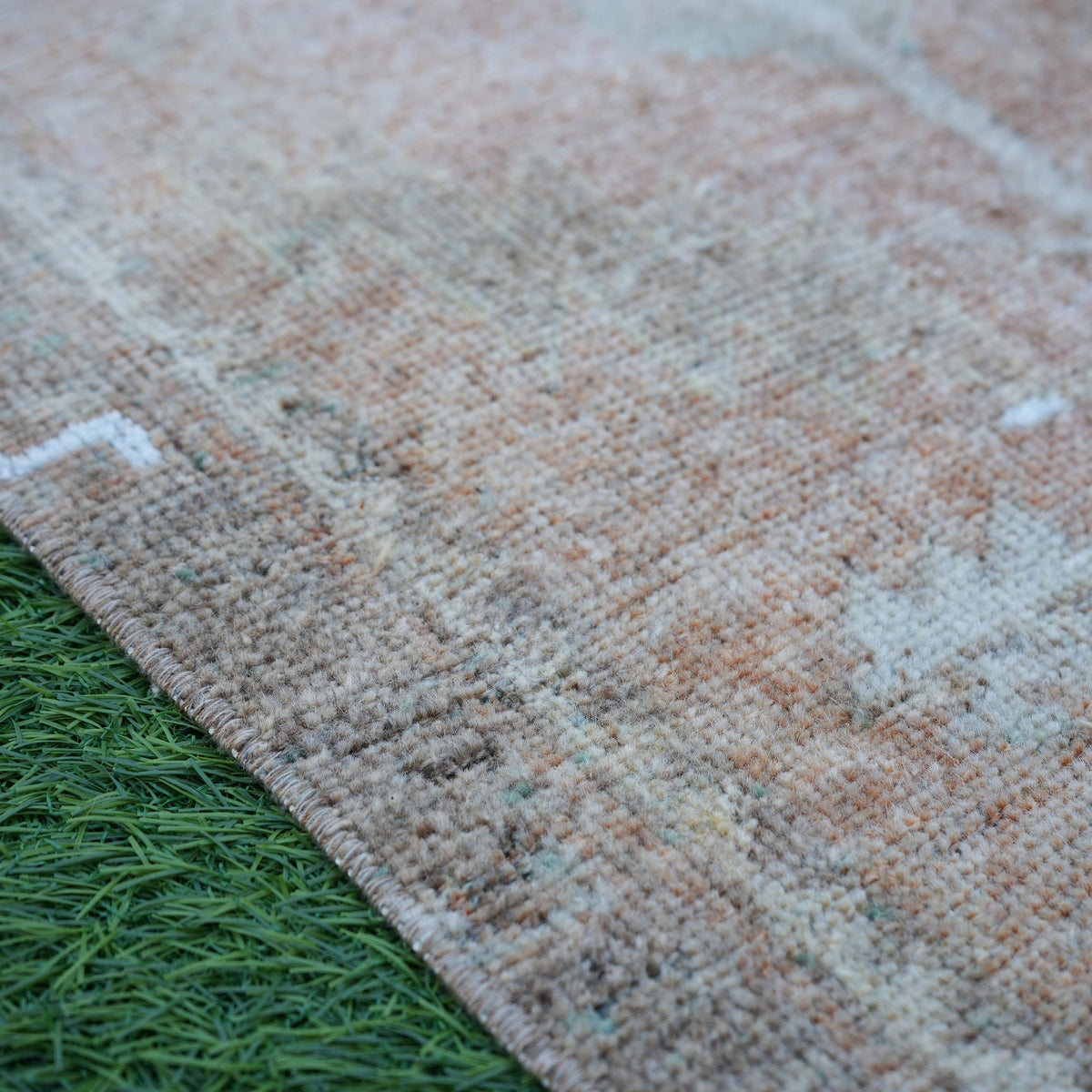 Brown 1' x 4' Turkish mini vintage rug in wool and cotton, shown on the floor.