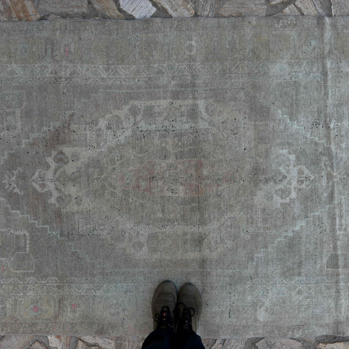 1970s beige Turkish muted vintage rug with neutral design, hand-knotted weave and low pile.