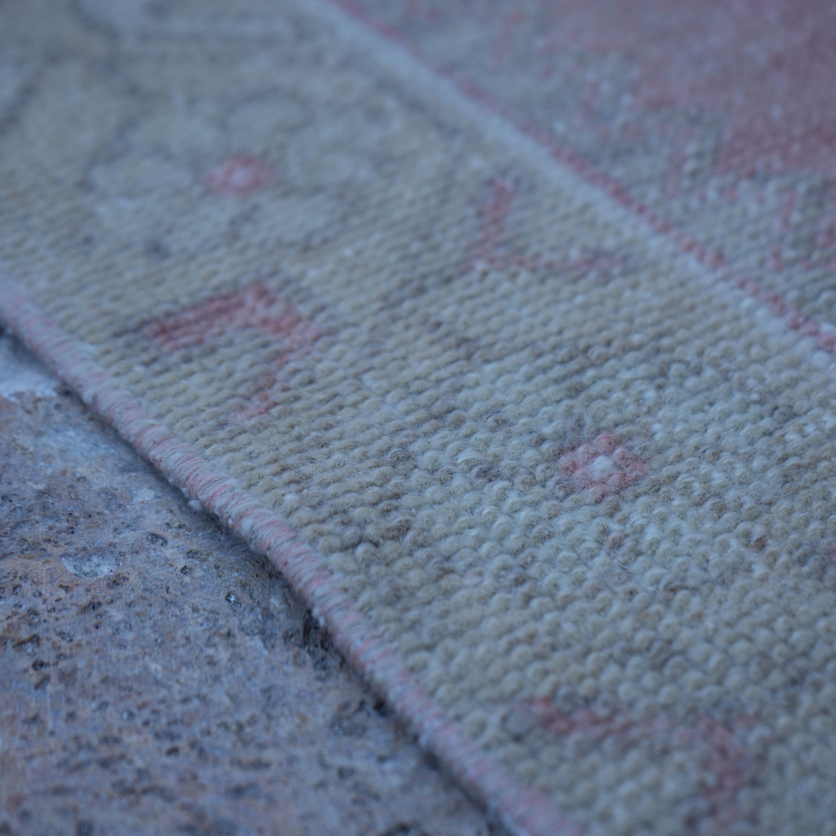 Pale Red 4' x 7' neutral turkish rug in wool and cotton, shown on the floor.