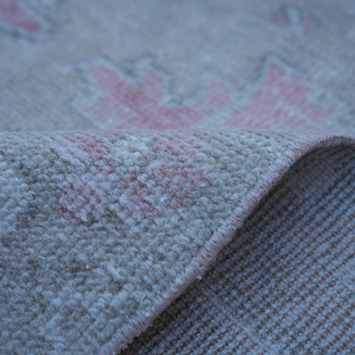 Additional view of the pale red neutral turkish rug, hand-knotted in wool and cotton.