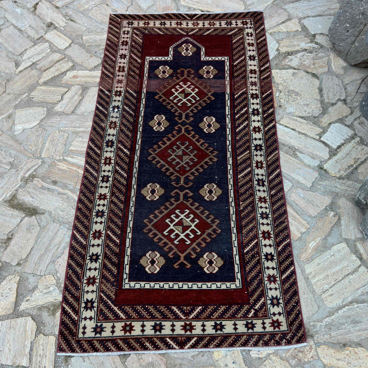 Blue 3' x 6' Turkish oriental wool rug in wool and cotton, shown on the floor.