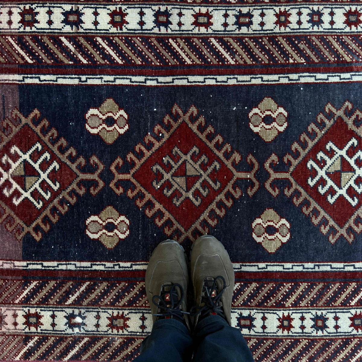 1970s blue Turkish oriental wool rug with traditional design, hand-knotted weave and low pile.