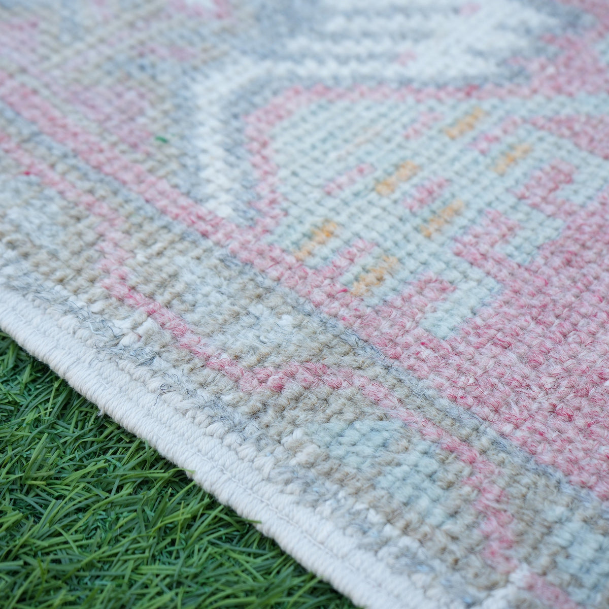 Red 1' x 3' Turkish oushak mini rug in wool and cotton, shown on the floor.