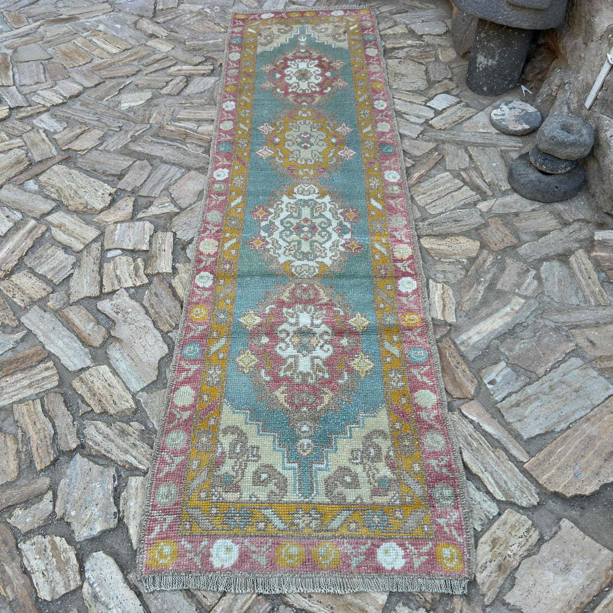 Green 3' x 11' Turkish oushak runner rug in wool and cotton, shown on the floor.
