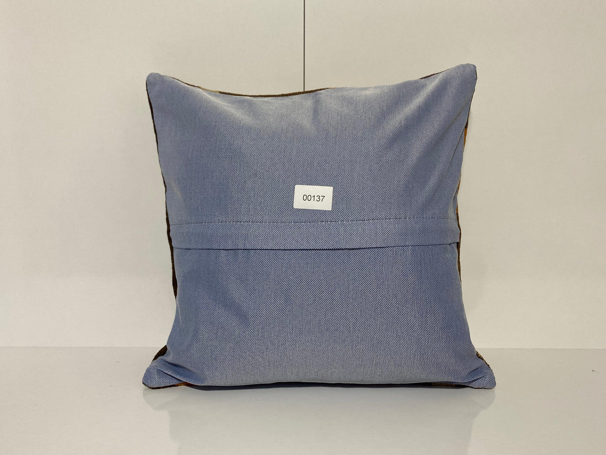 Close-up of the colorful Turkish pillow cover showing geometric details, low pile.