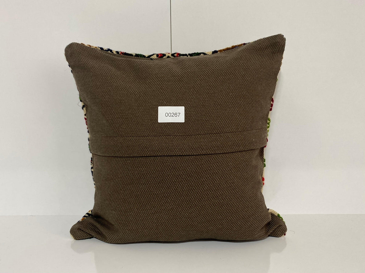 Close-up of the colorful Turkish pillow cover showing traditional details, low pile.