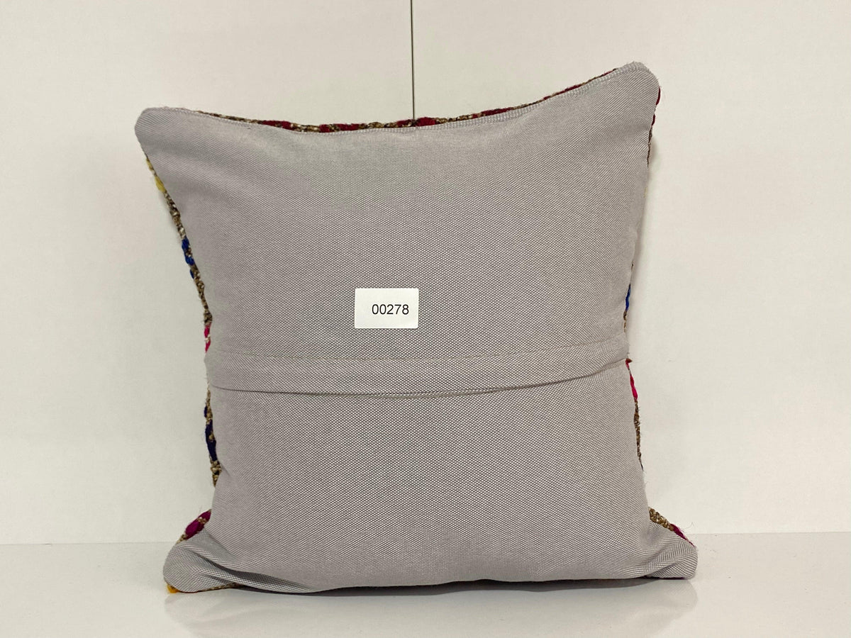 Close-up of the colorful Turkish pillow cover showing traditional details, low pile.