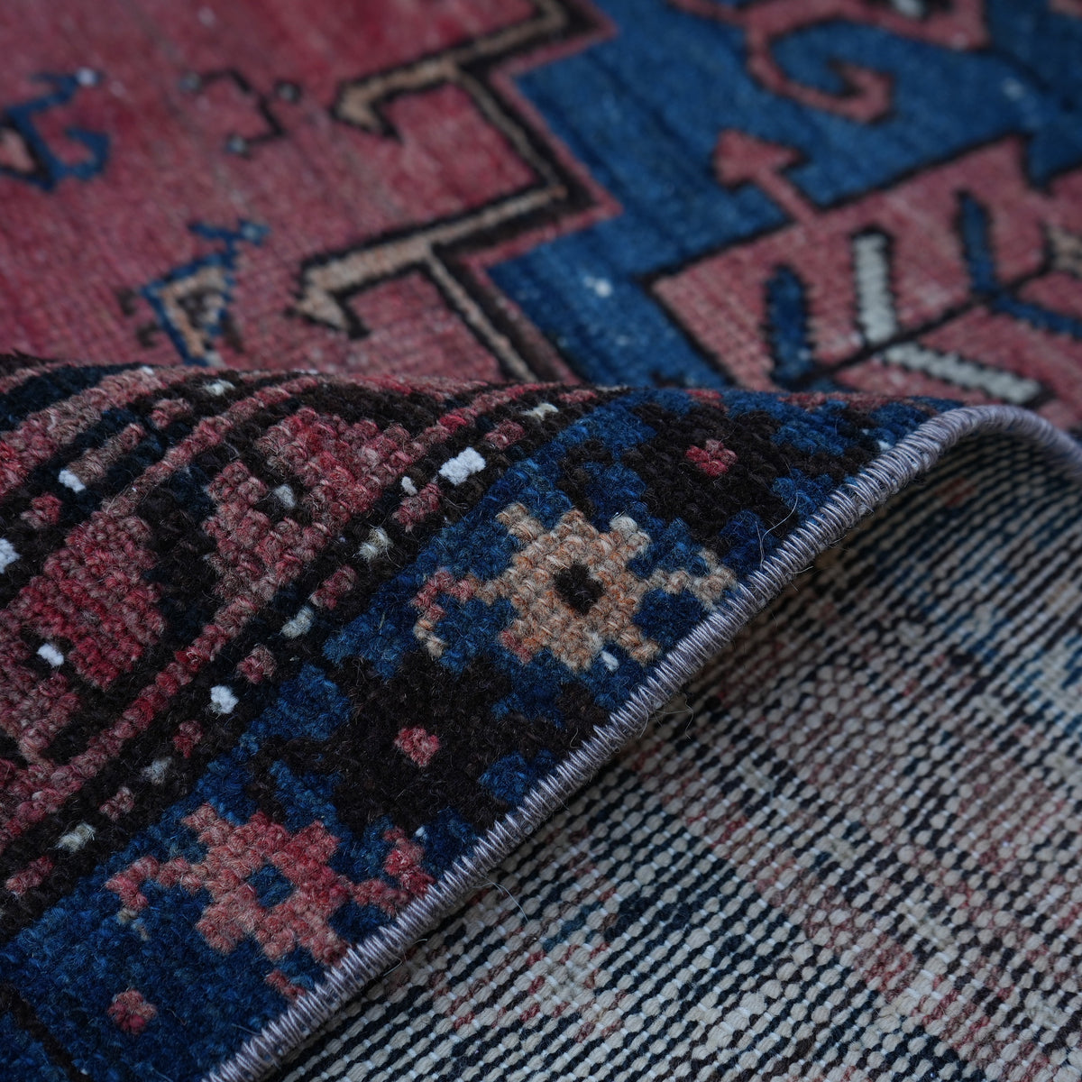 Additional view of the red small persian rug, hand-knotted in wool and cotton.