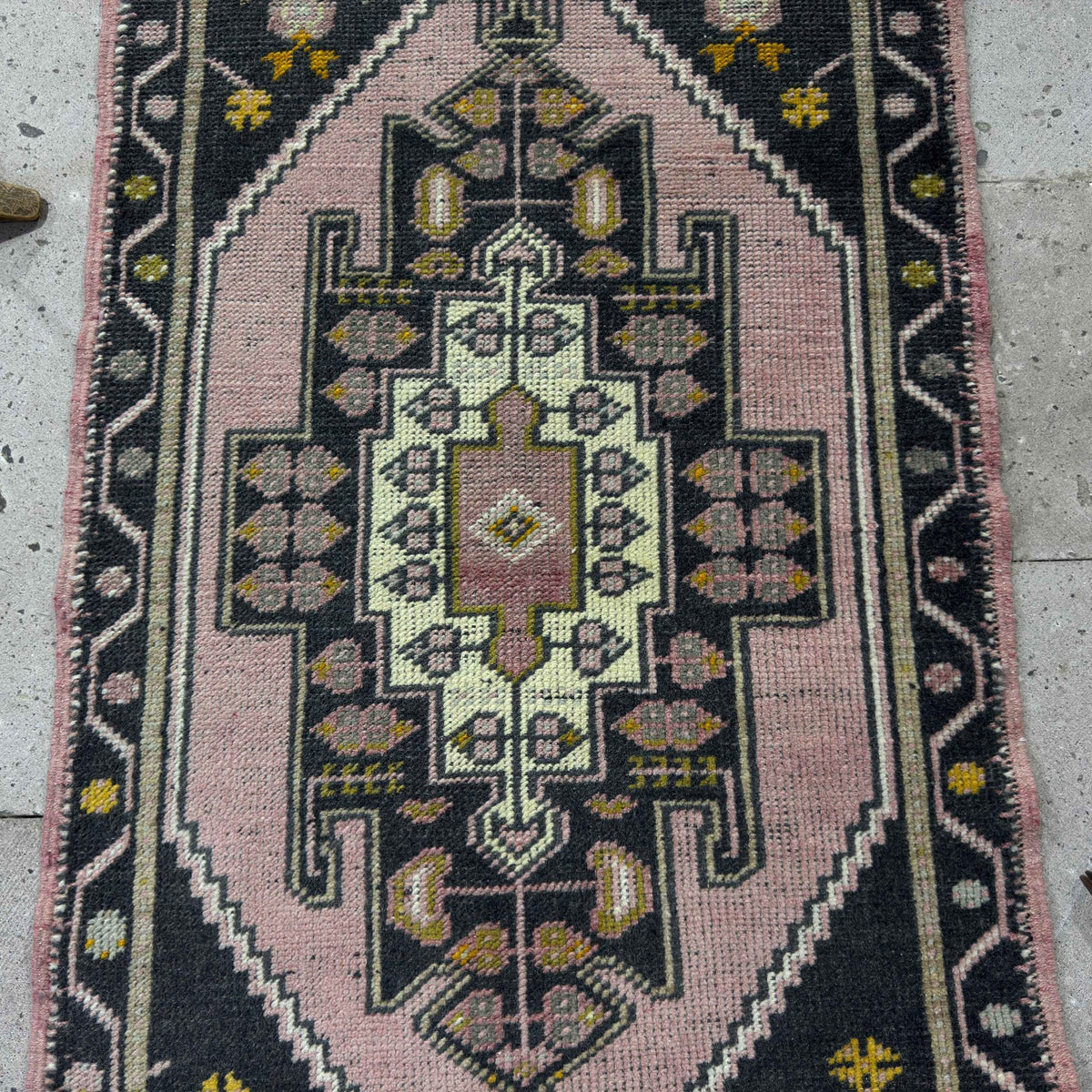 1970s pink Turkish small runner rug with traditional design, hand-knotted weave and low pile.