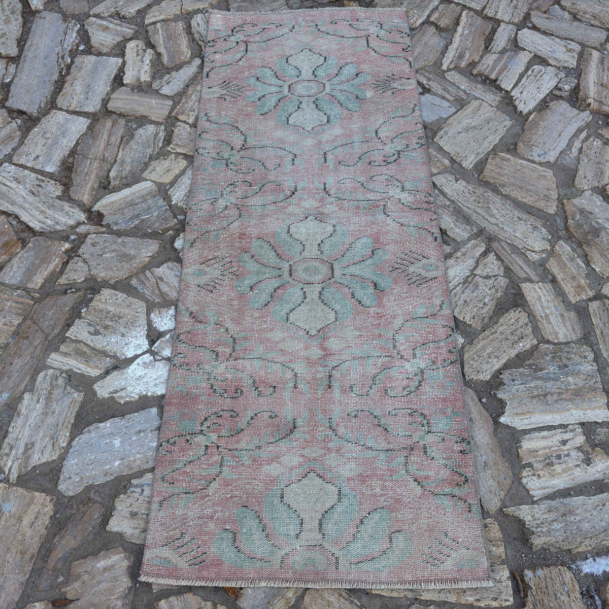Pink 3' x 7' Turkish small runner rug in wool and cotton, shown on the floor.