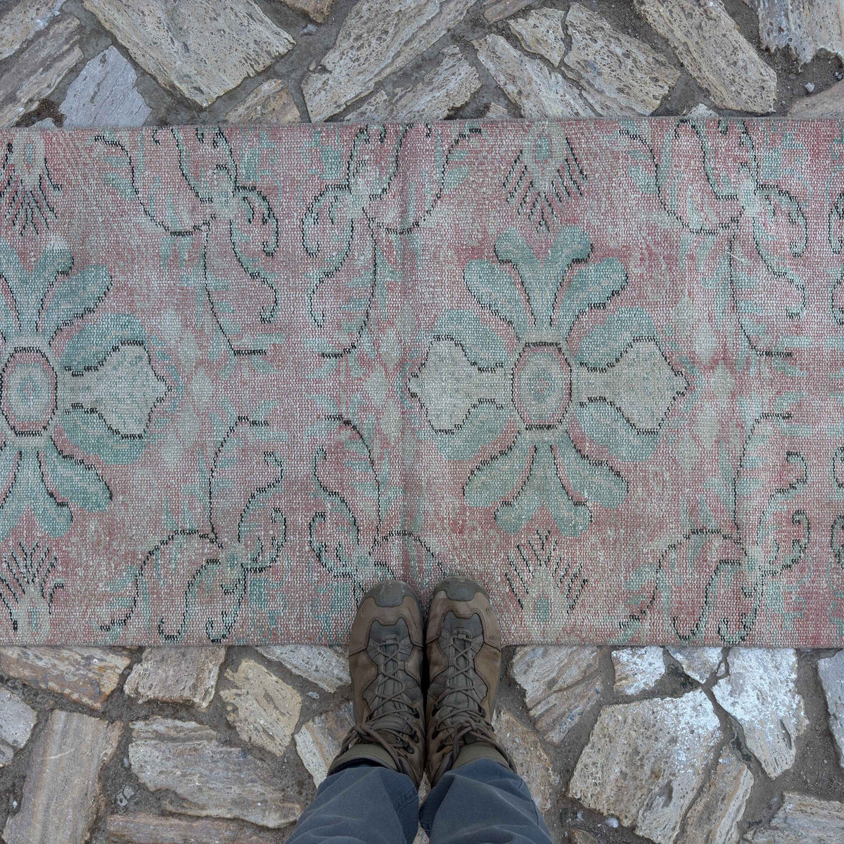 1970s pink Turkish small runner rug with traditional design, hand-knotted weave and low pile.