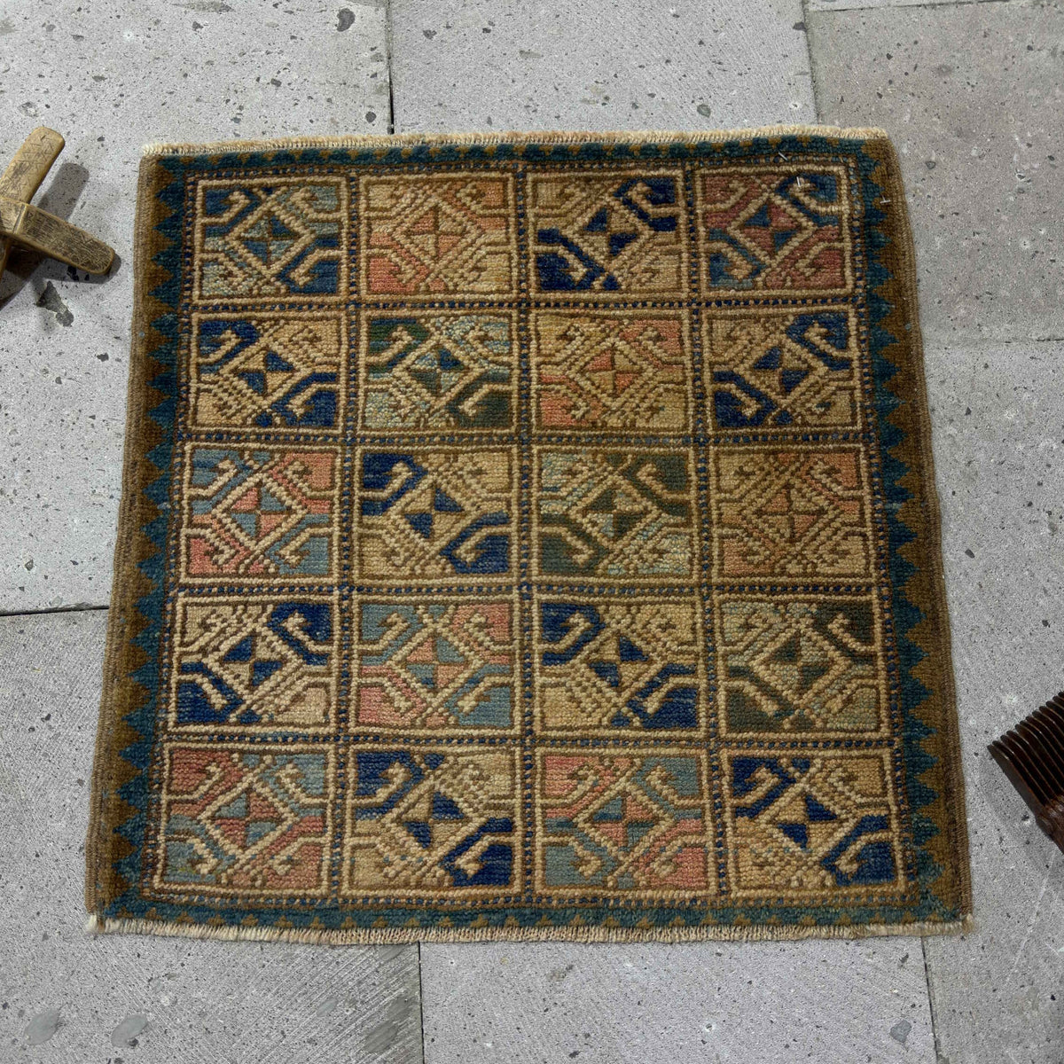 Blue 2' x 2' Turkish small square rug in wool and cotton, shown on the floor.