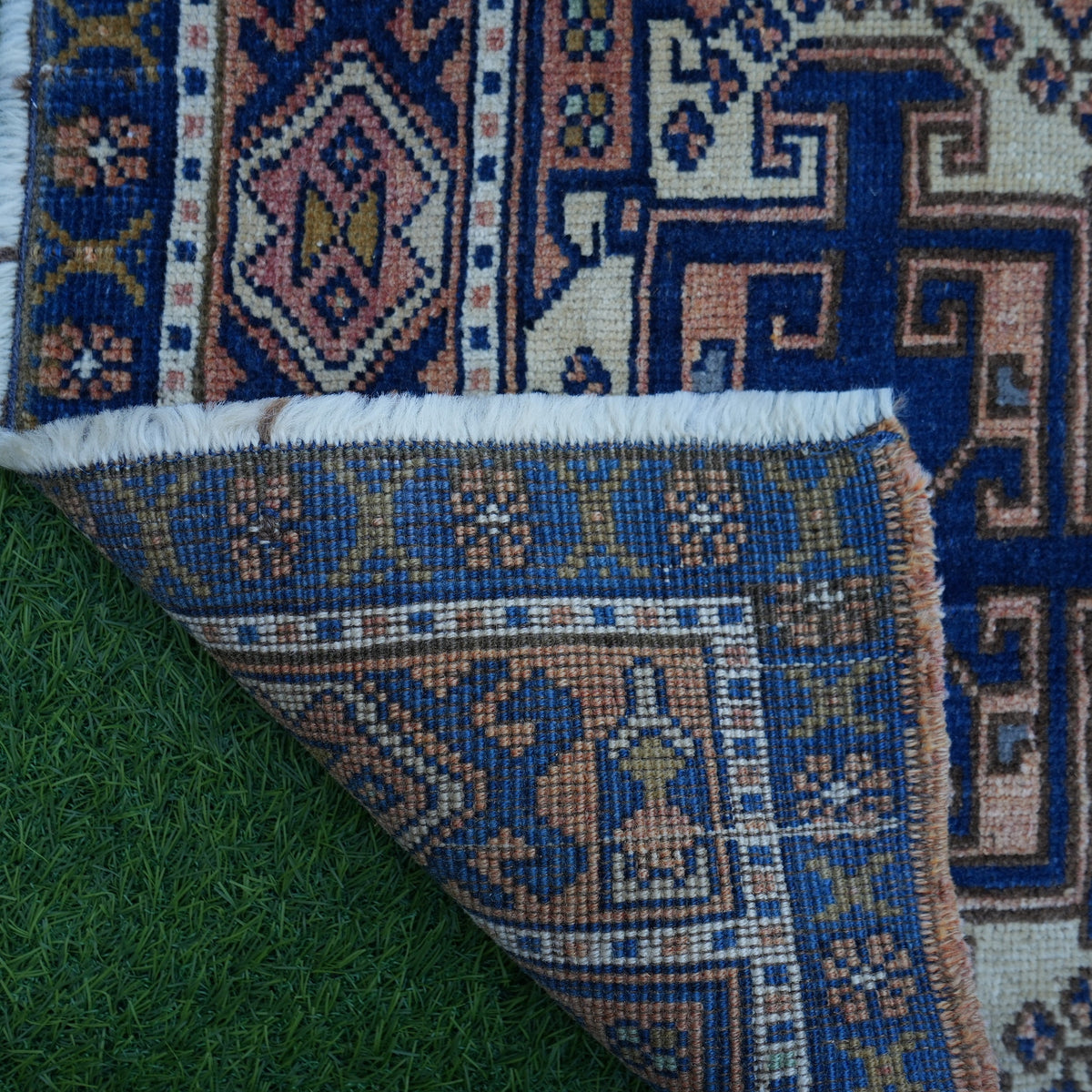 1970s blue small turkish rug with traditional design, hand-knotted weave and low pile.