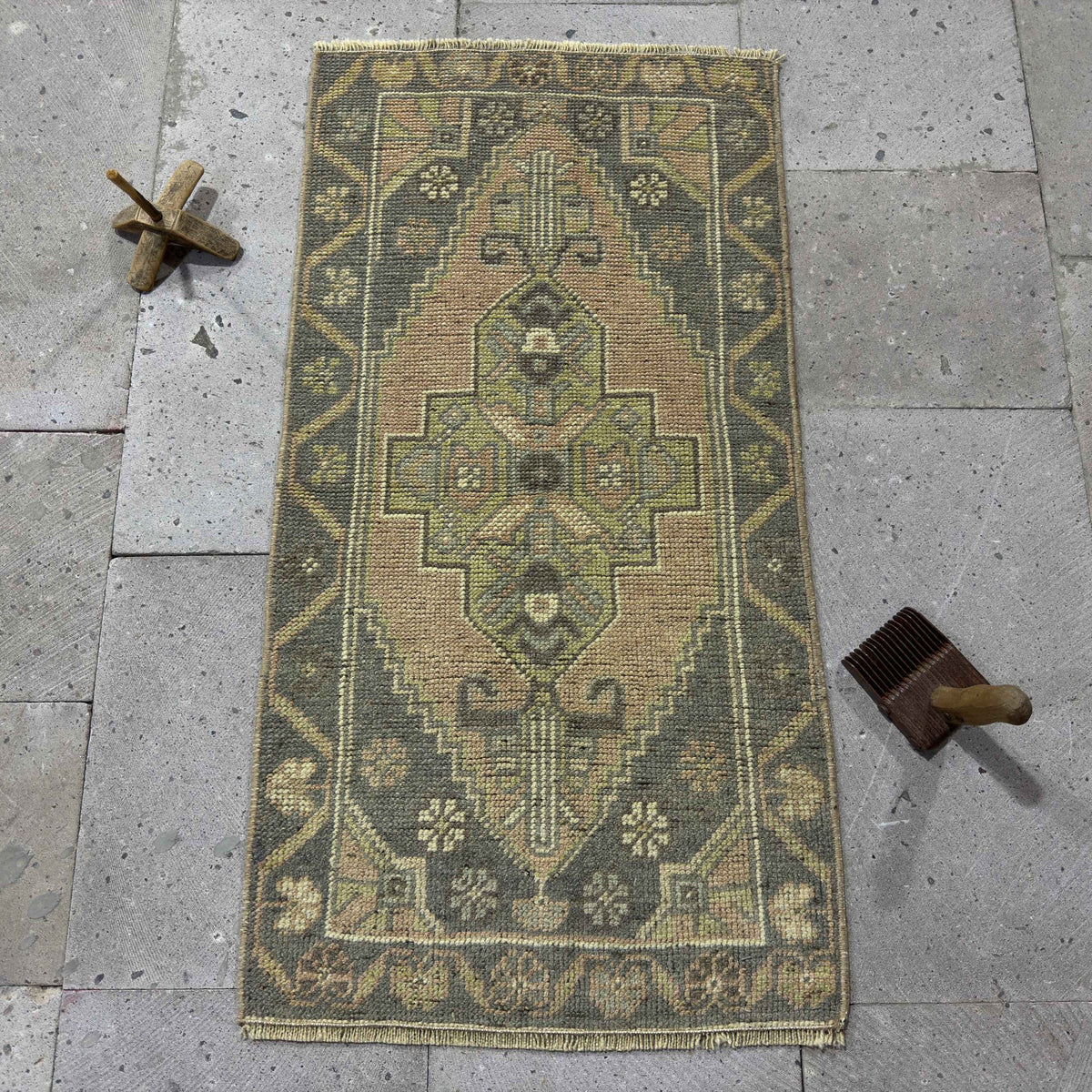Gray 2' x 3' Turkish small vintage rug in wool and cotton, shown on the floor.