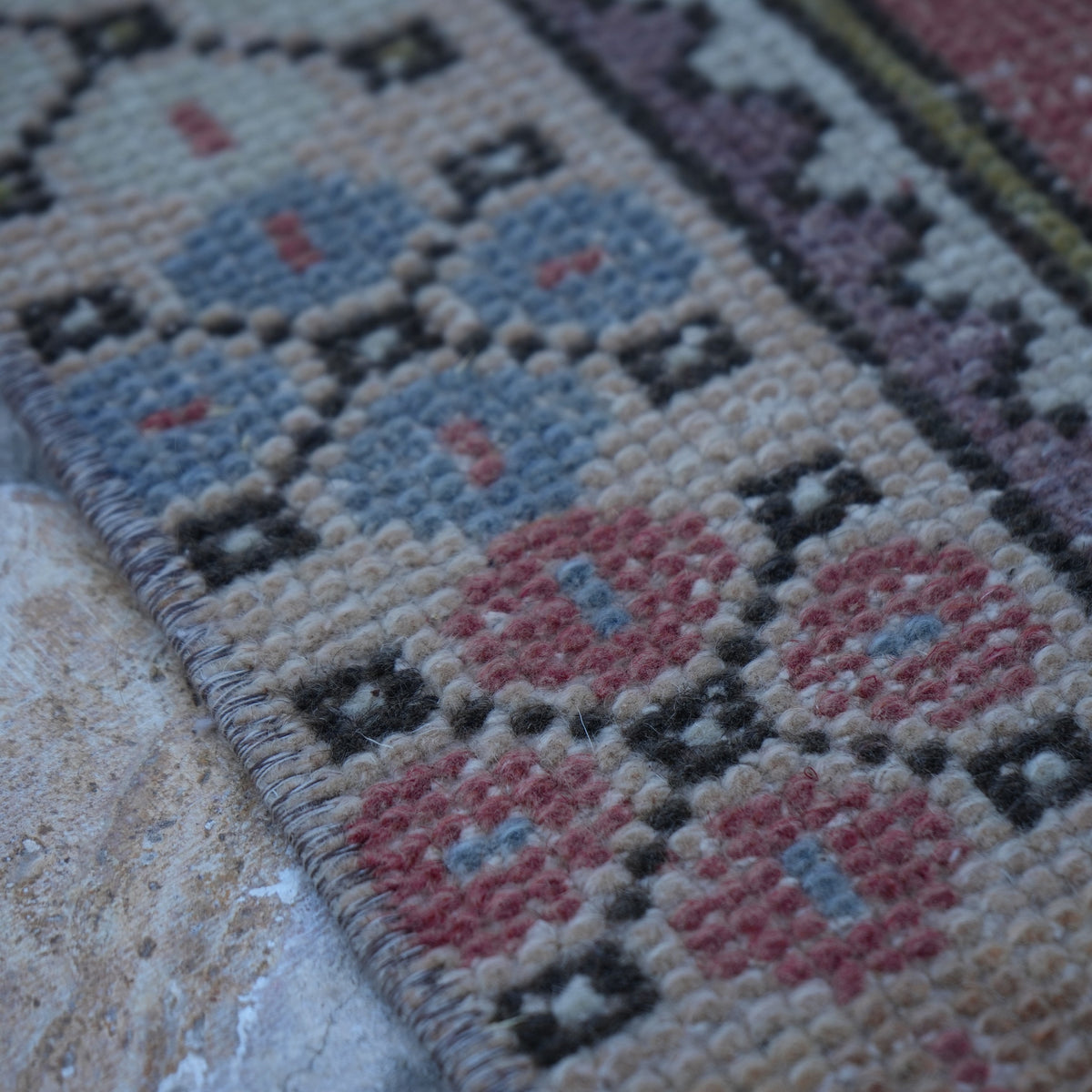 Pale Red 3' x 6' Turkish small vintage rug in wool and cotton, shown on the floor.