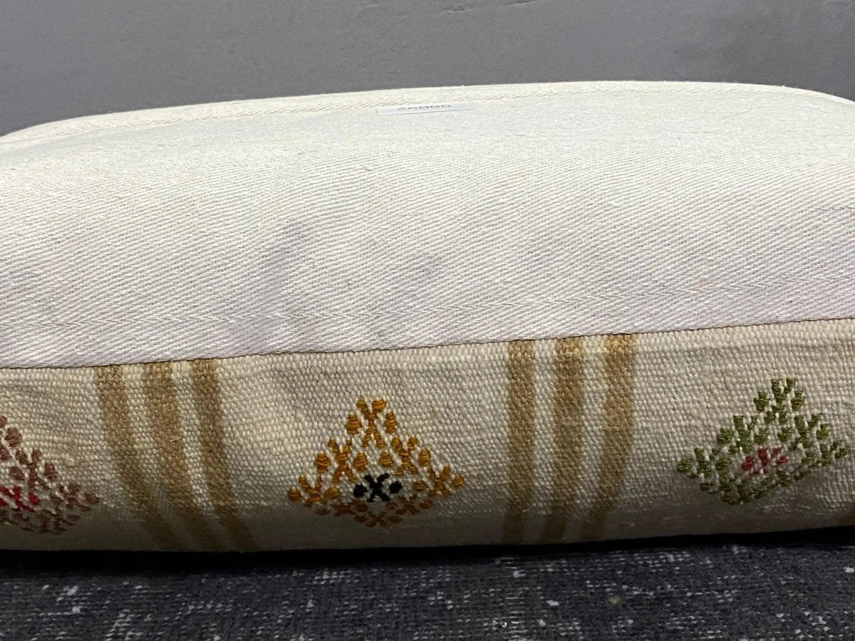 Turkish throw pillow, shown on the floor.