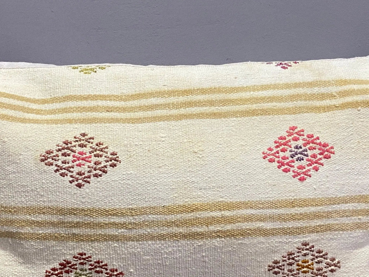 Close-up of the beige Turkish throw pillow showing traditional details, low pile.
