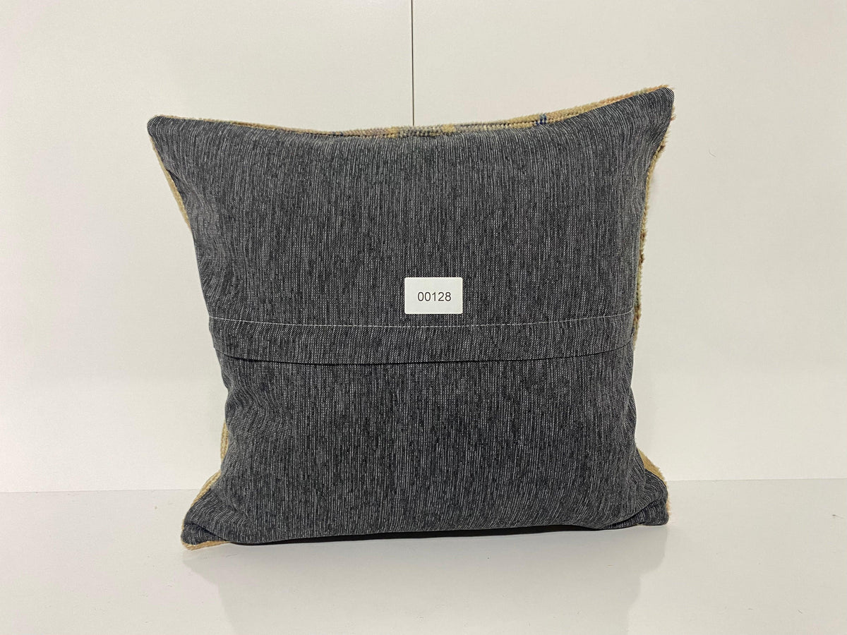 Close-up of the beige Turkish throw pillow showing neutral details, low pile.