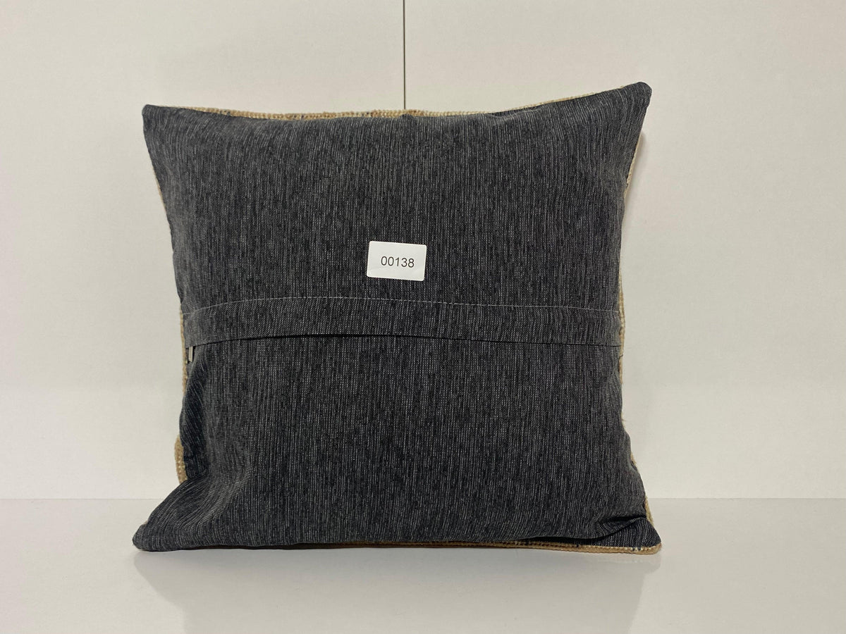 Close-up of the beige Turkish throw pillow showing neutral details, low pile.