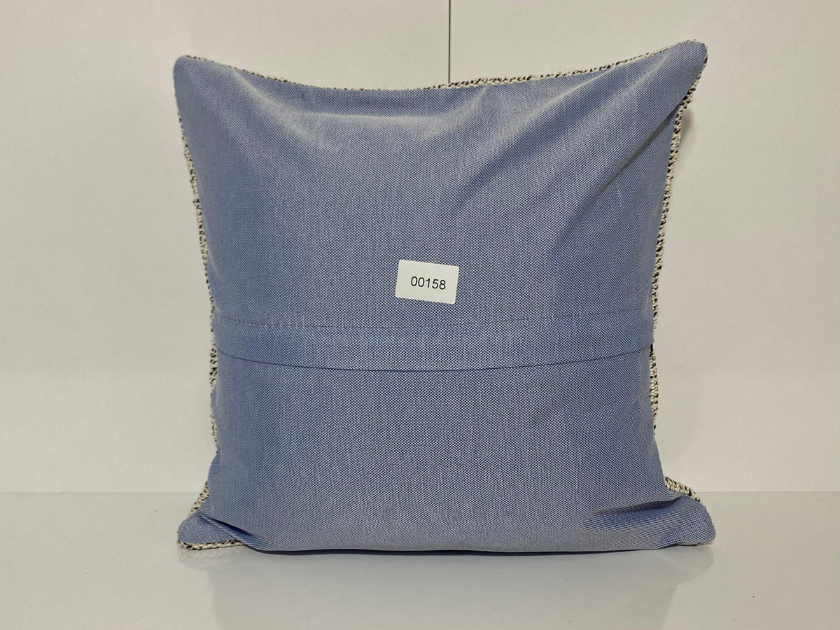 Close-up of the beige Turkish throw pillow showing traditional details, low pile.