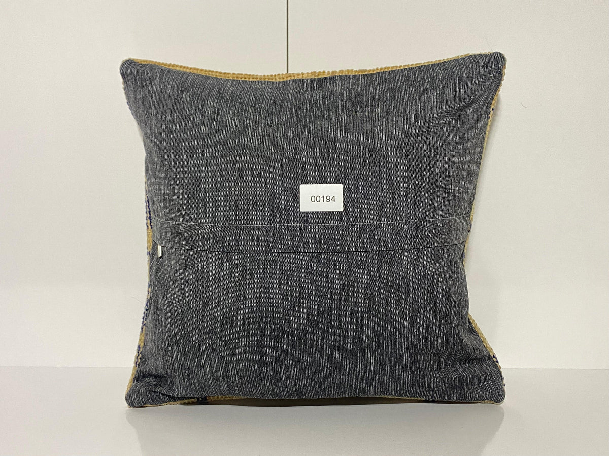 Close-up of the beige Turkish throw pillow showing neutral details, low pile.