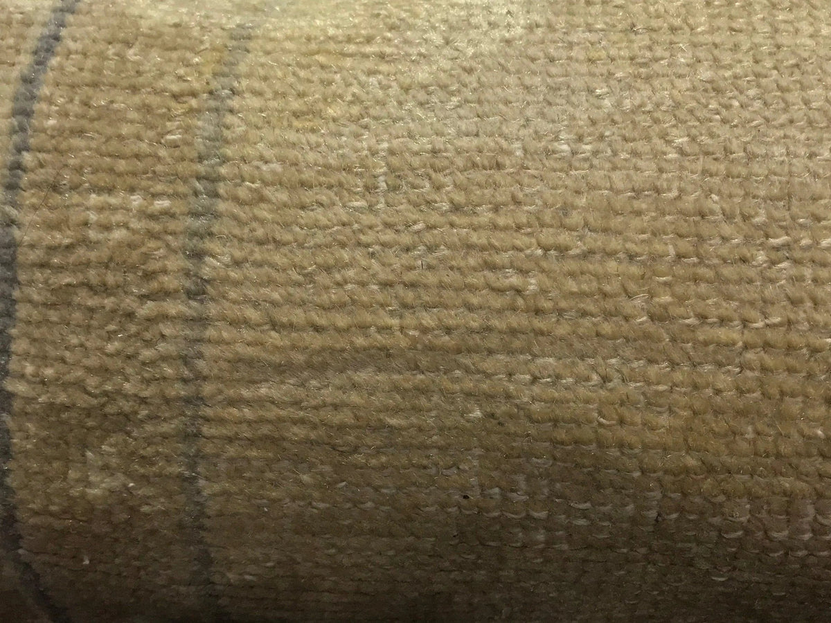 Beige Turkish throw pillow, shown on the floor.